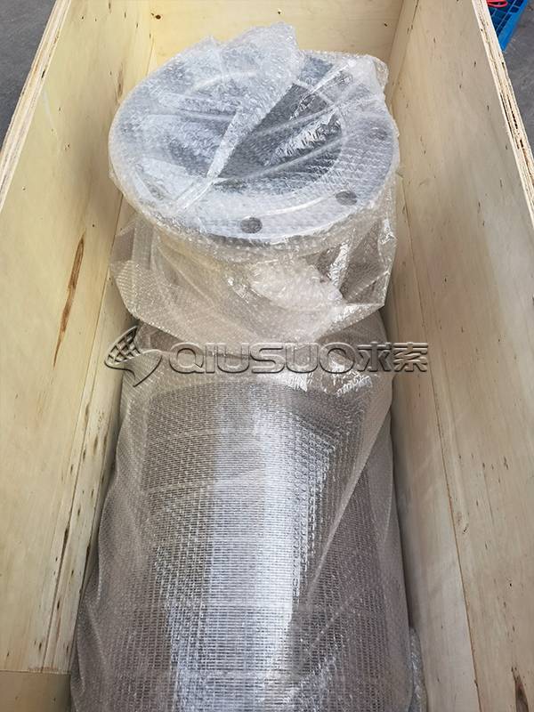 An intake screen is wrapped in bubble film and placed in the wooden carton.